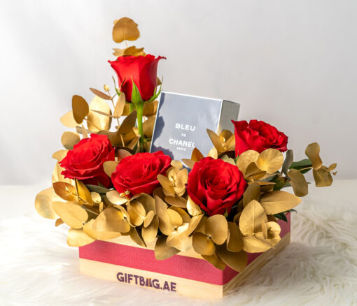 Chanel Bleu with Red & Gold Flower Arrangement in Dubai