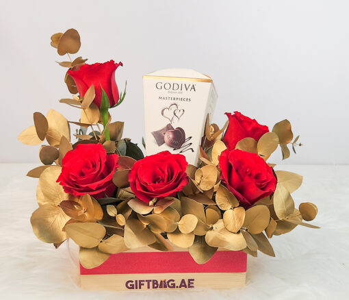 Godiva Masterpieces with Red & Gold Floral Arrangement in Dubai
